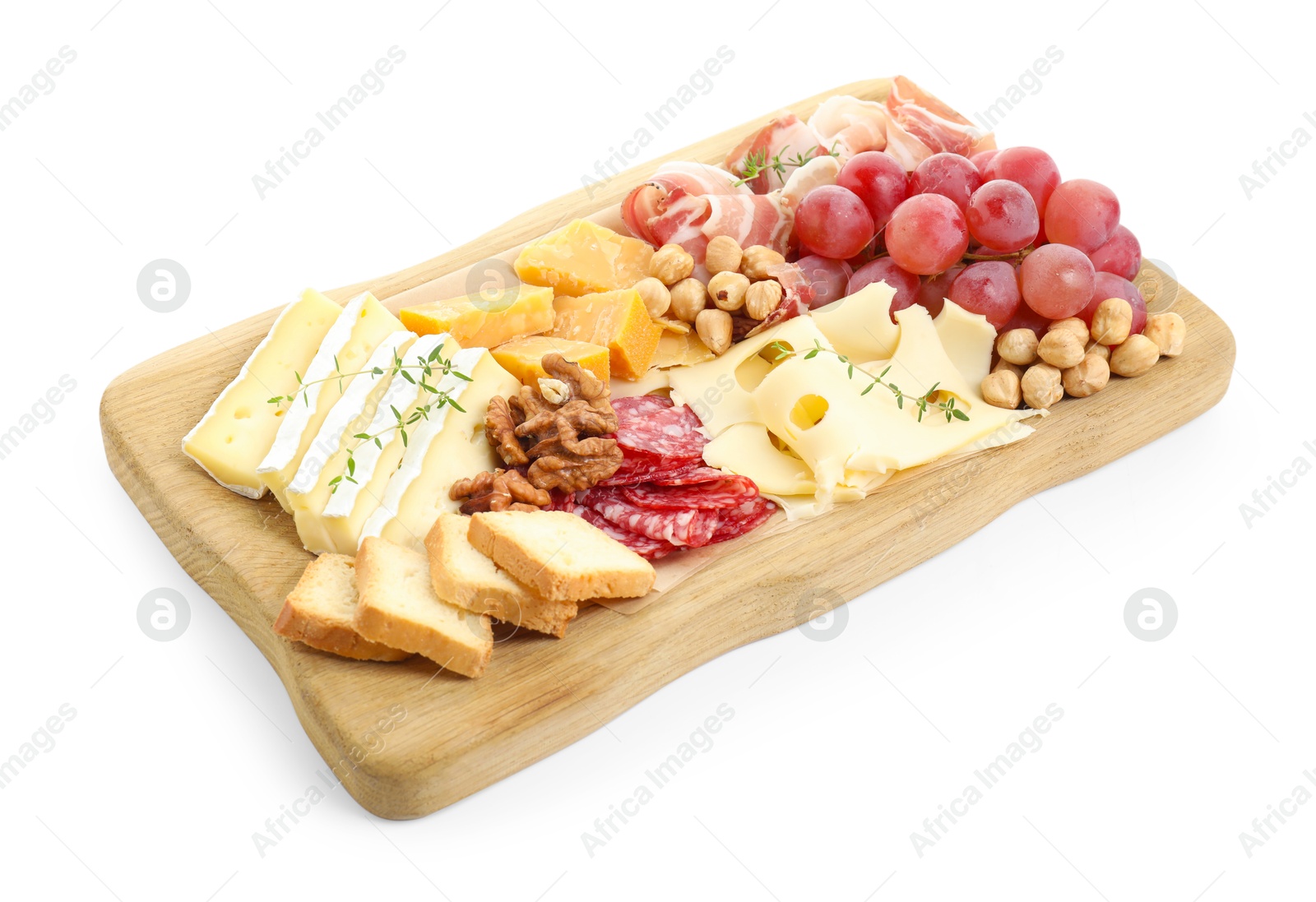 Photo of Different types of cut cheese and other snacks isolated on white