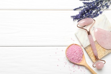 Photo of Face roller, gua sha tool, sea salt and lavender flowers on white wooden background, flat lay. Space for text