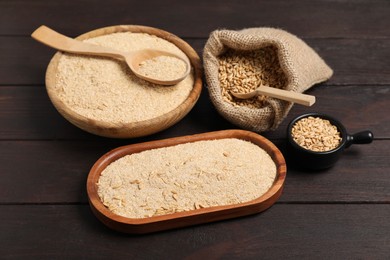 Photo of Oat bran and grains on wooden table