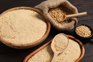 Photo of Oat bran and grains on wooden table, closeup