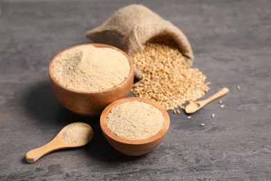 Photo of Oat bran and grains on grey table