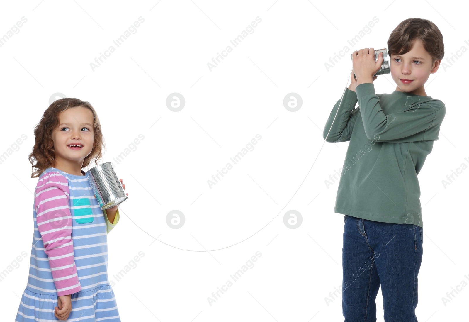 Photo of Boy and girl talking on tin can telephone against white background