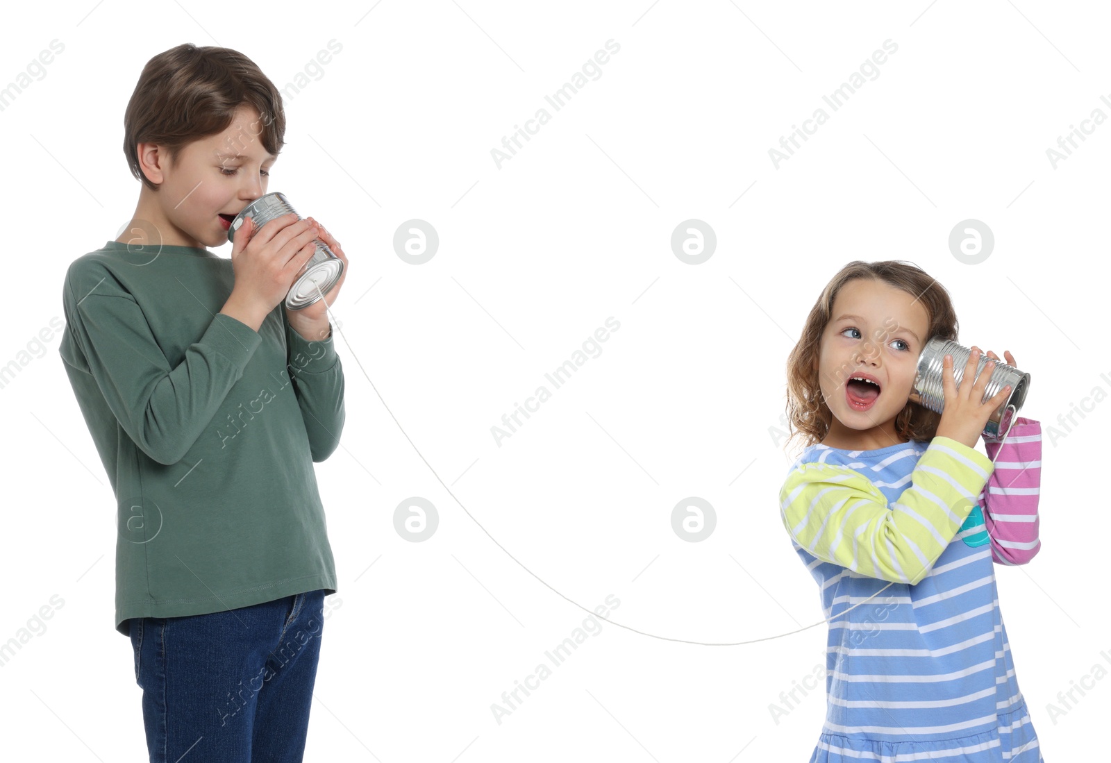 Photo of Boy and girl talking on tin can telephone against white background