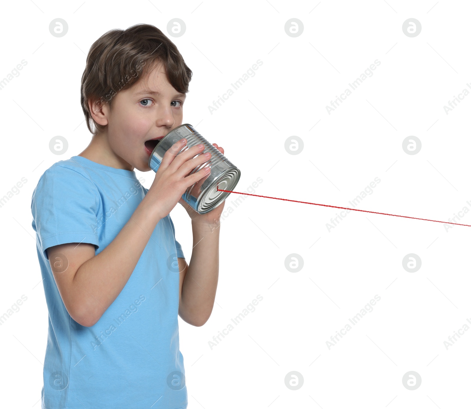 Photo of Boy using tin can telephone on white background