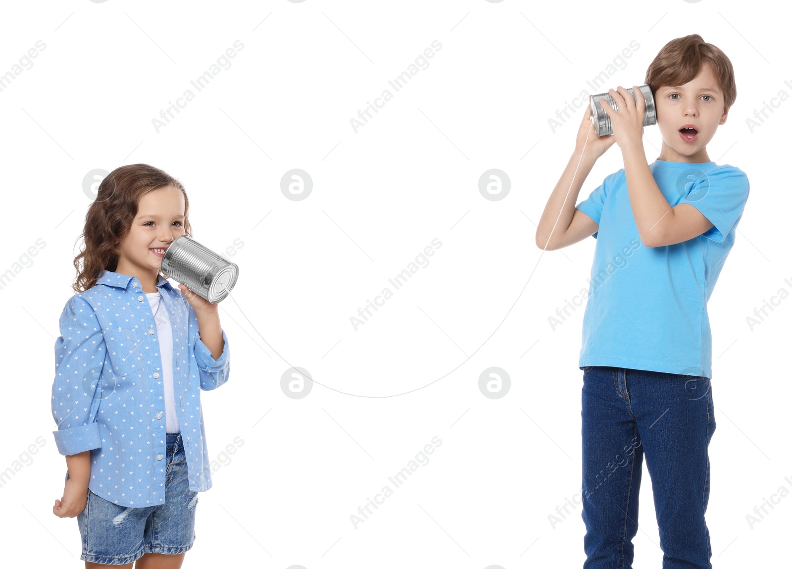 Photo of Boy and girl talking on tin can telephone against white background