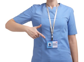 Photo of Medical assistant pointing at her badge on white background, closeup