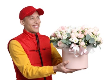 Smiling delivery man holding gift box with beautiful floral composition on white background