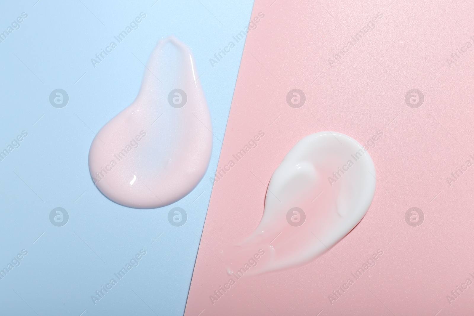 Photo of Cream samples on color background, top view