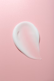 Photo of Cream sample on pink background, top view