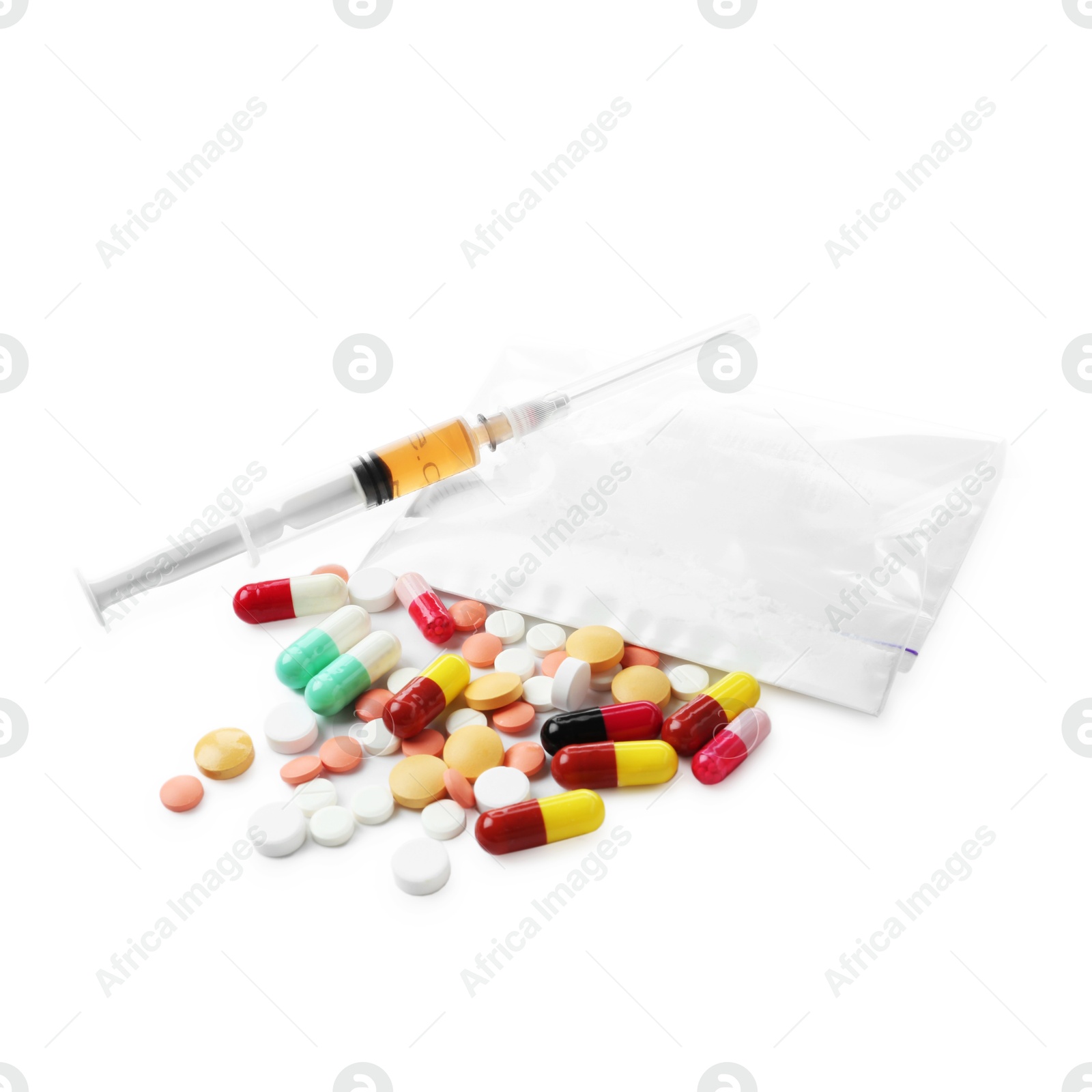 Photo of Drug addiction. Different pills, plastic bag with powder and syringe isolated on white