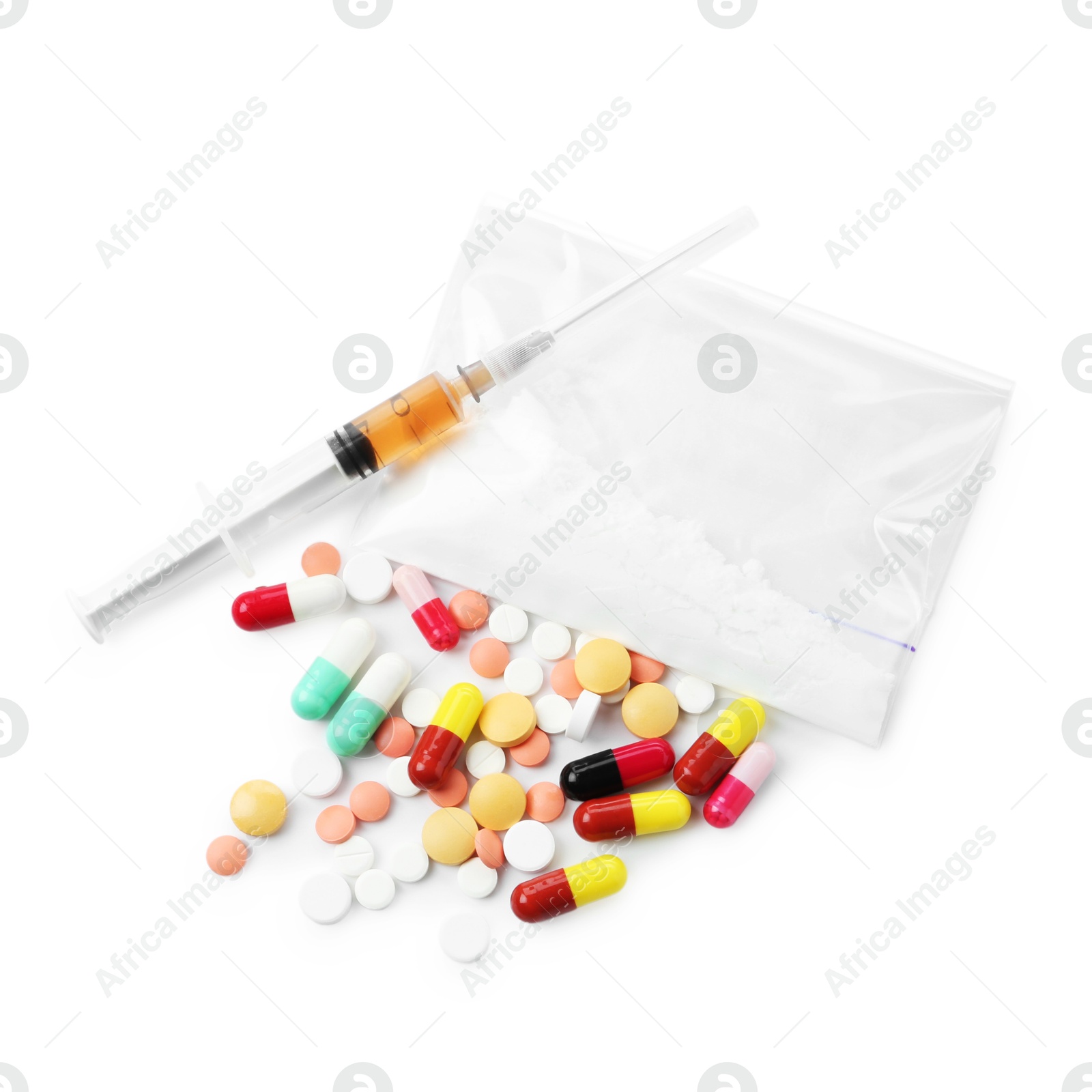 Photo of Drug addiction. Different pills, plastic bag with powder and syringe isolated on white, top view