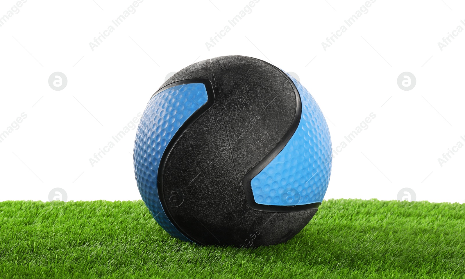 Photo of Ball on artificial grass isolated on white. Sport equipment