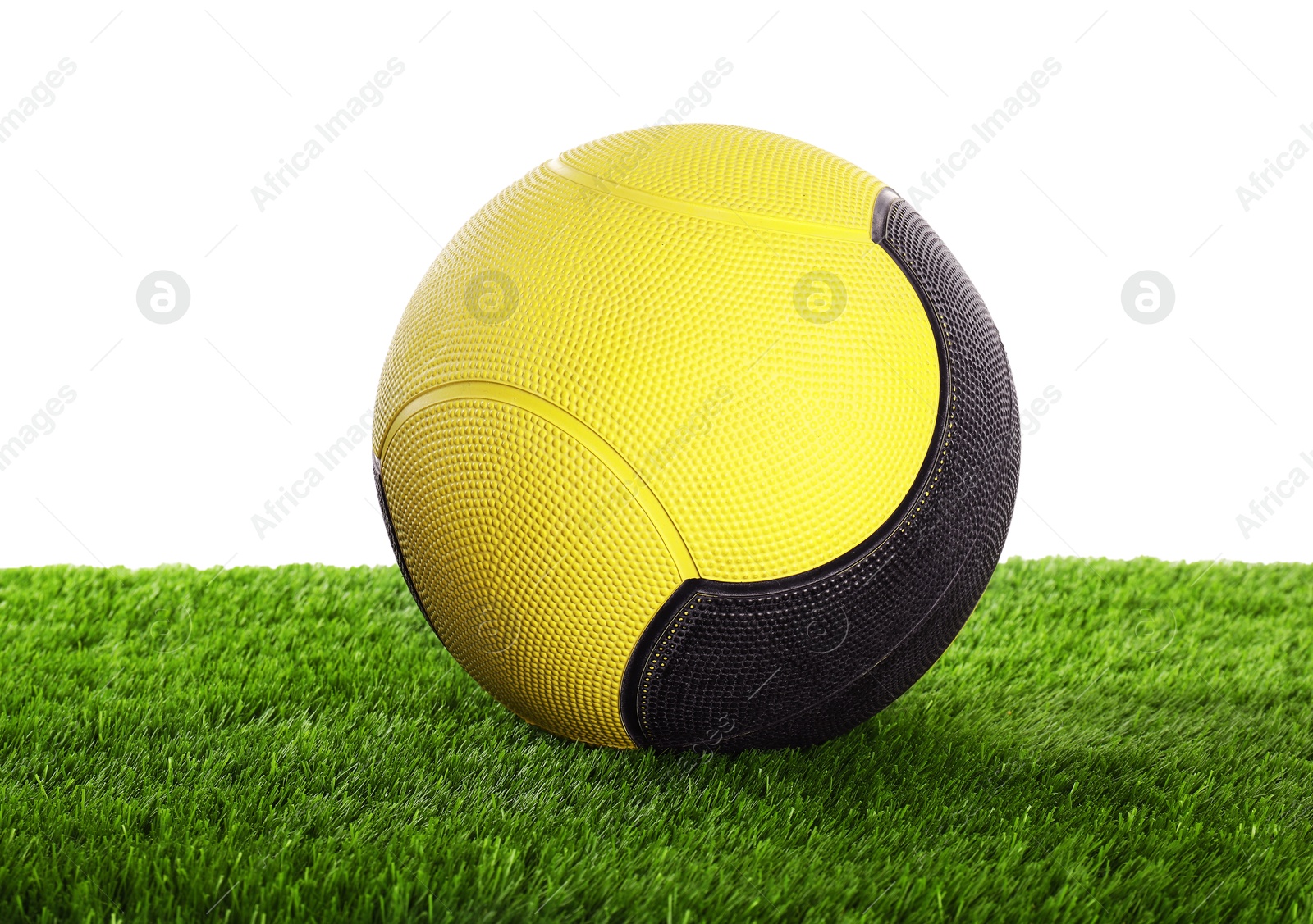 Photo of Ball on artificial grass isolated on white. Sport equipment