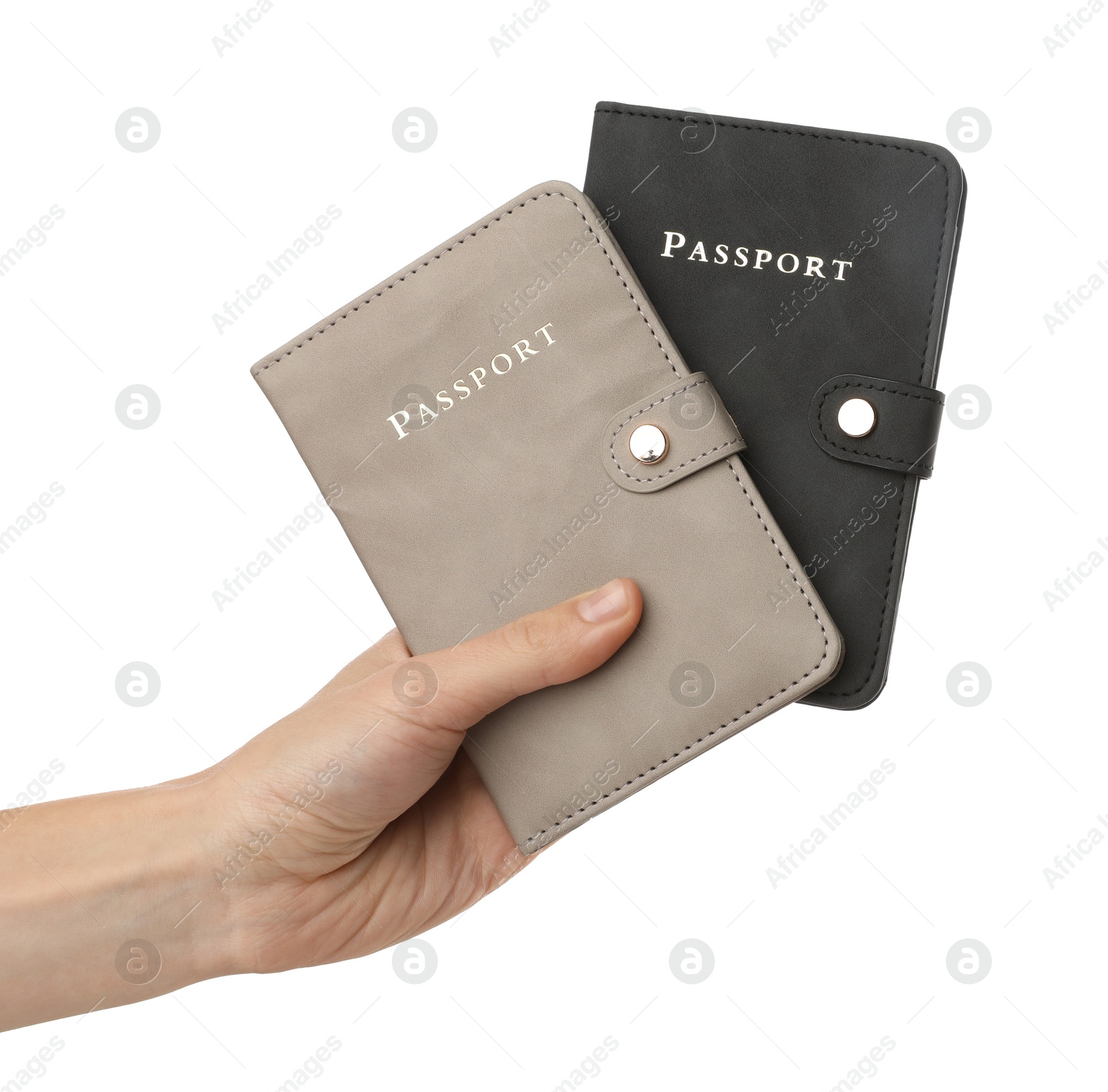 Photo of Woman holding passports in bright covers on white background, closeup