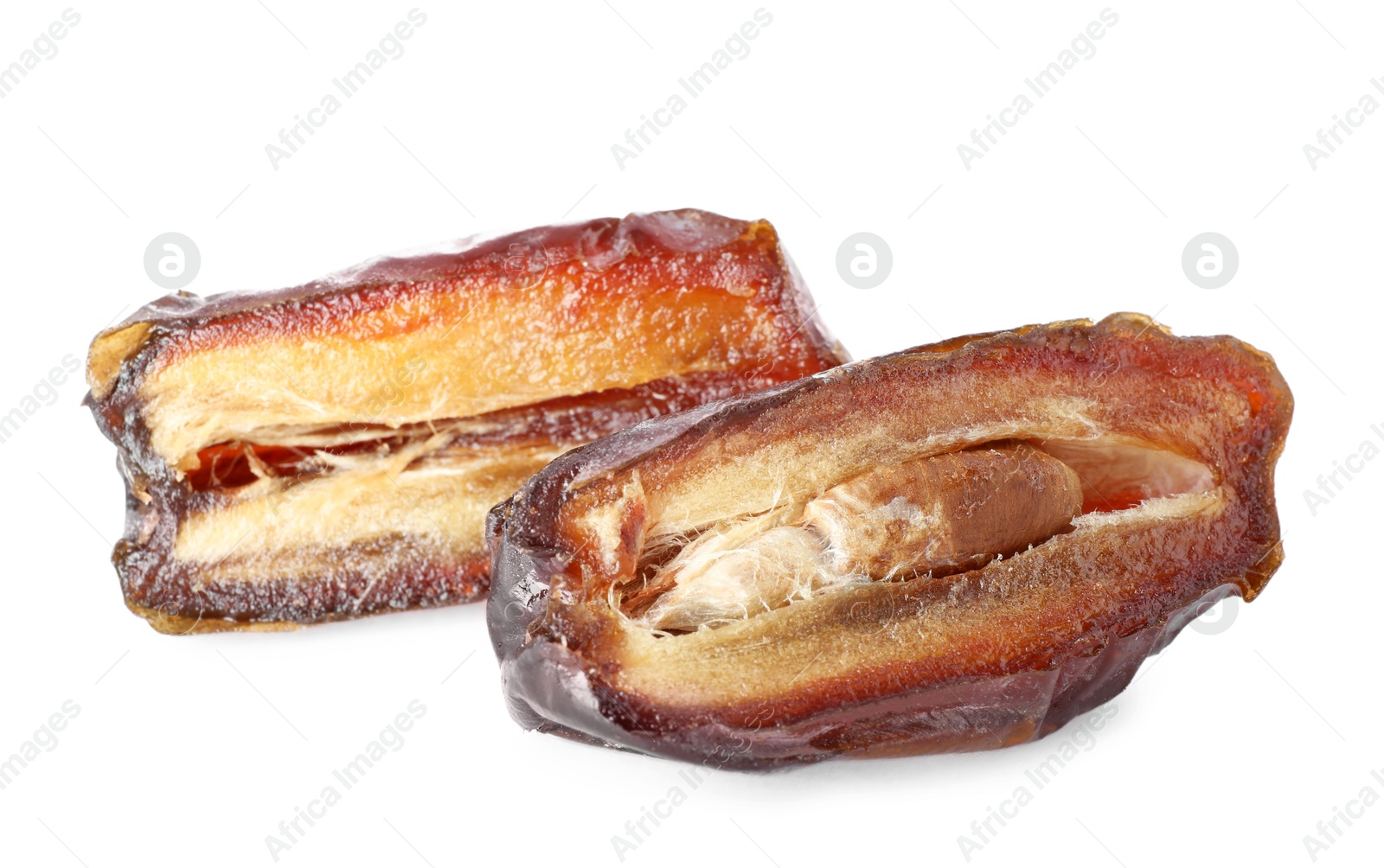 Photo of Pieces of dried date isolated on white