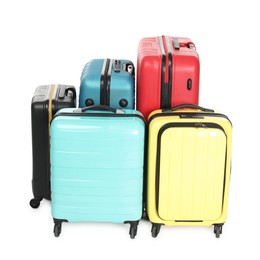 Photo of Many closed colorful suitcases isolated on white