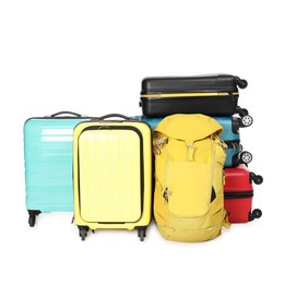 Photo of Many colorful suitcases and backpack isolated on white