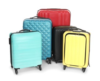 Photo of Many closed colorful suitcases isolated on white