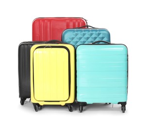 Photo of Many closed colorful suitcases isolated on white