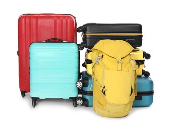 Photo of Many colorful suitcases and backpack isolated on white