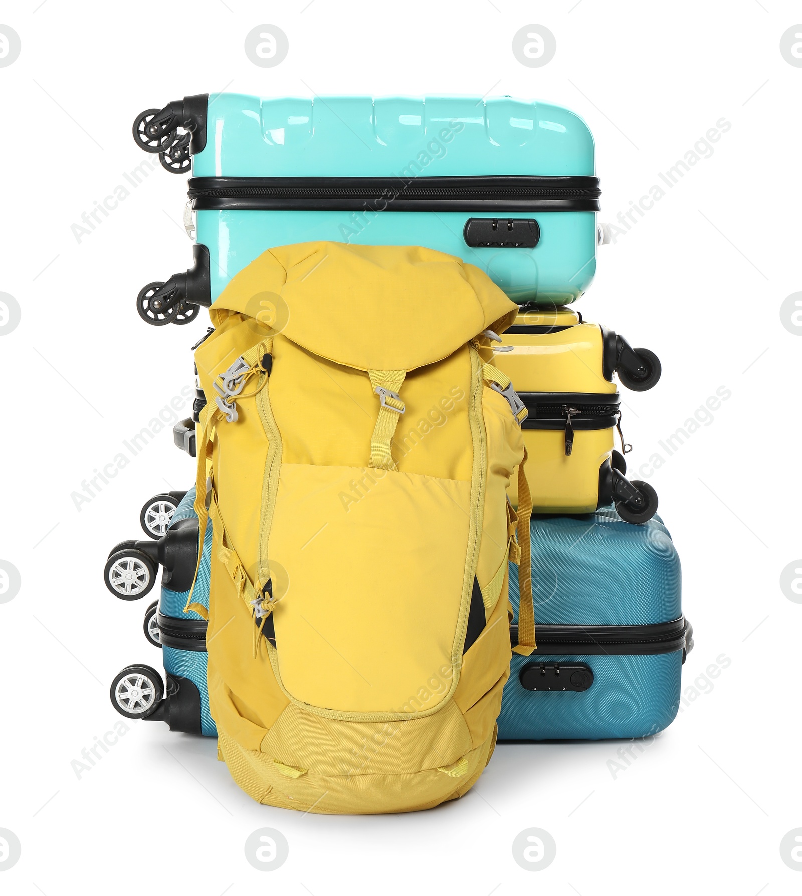 Photo of Stack of colorful suitcases and backpack isolated on white