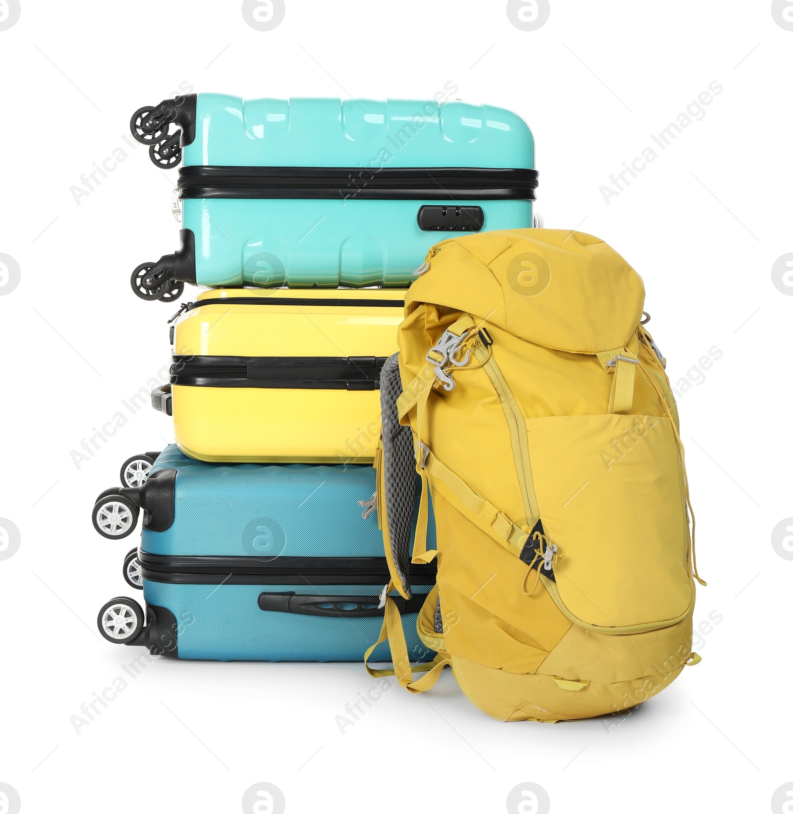 Photo of Stack of colorful suitcases and backpack isolated on white