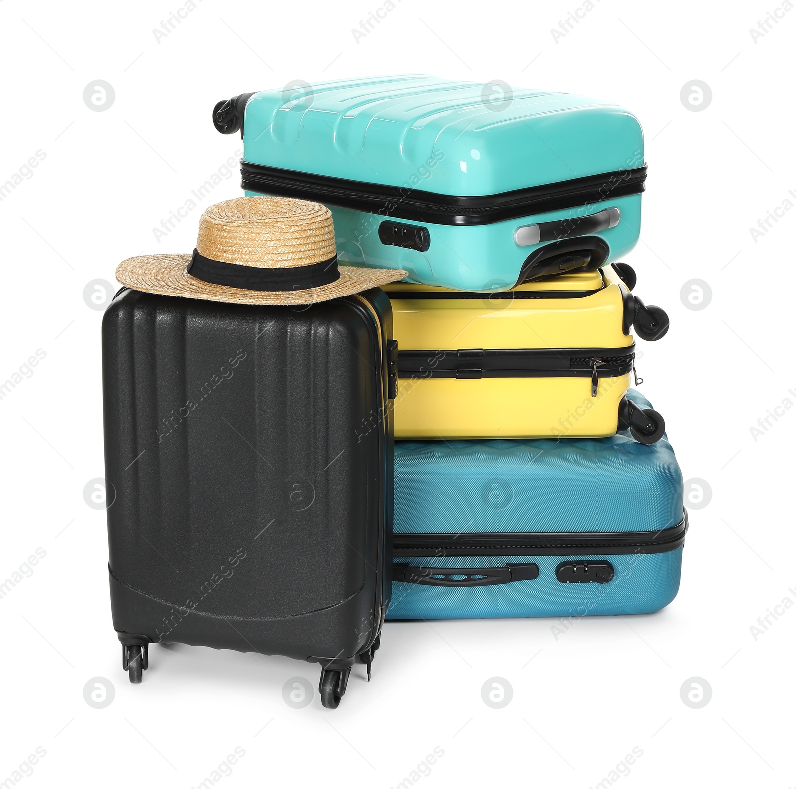 Photo of Many colorful suitcases and straw hat isolated on white