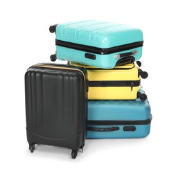 Photo of Stack of colorful suitcases isolated on white