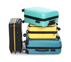 Photo of Stack of colorful suitcases isolated on white