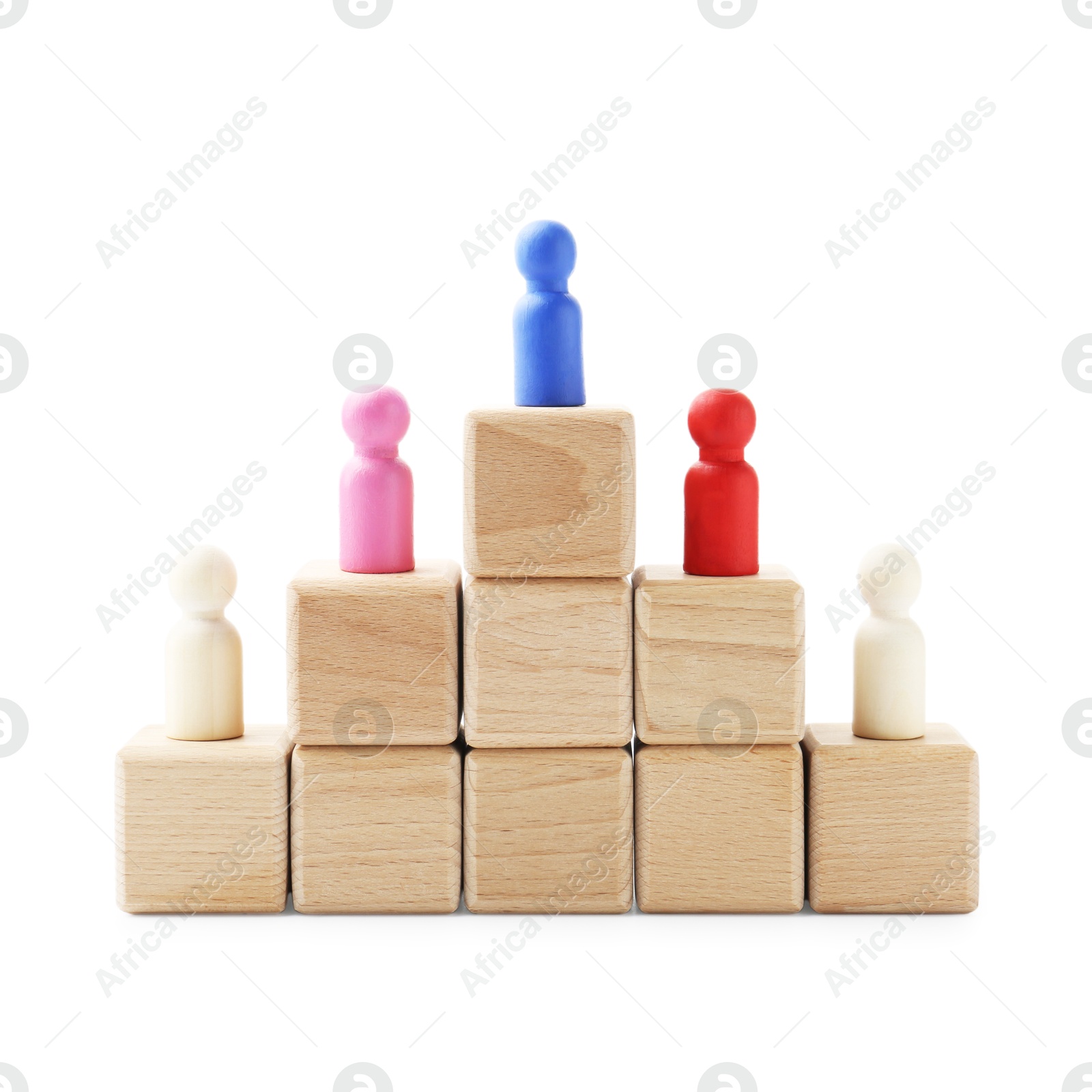 Photo of Human figures on wooden blocks, blue one on top against white background. Competition concept