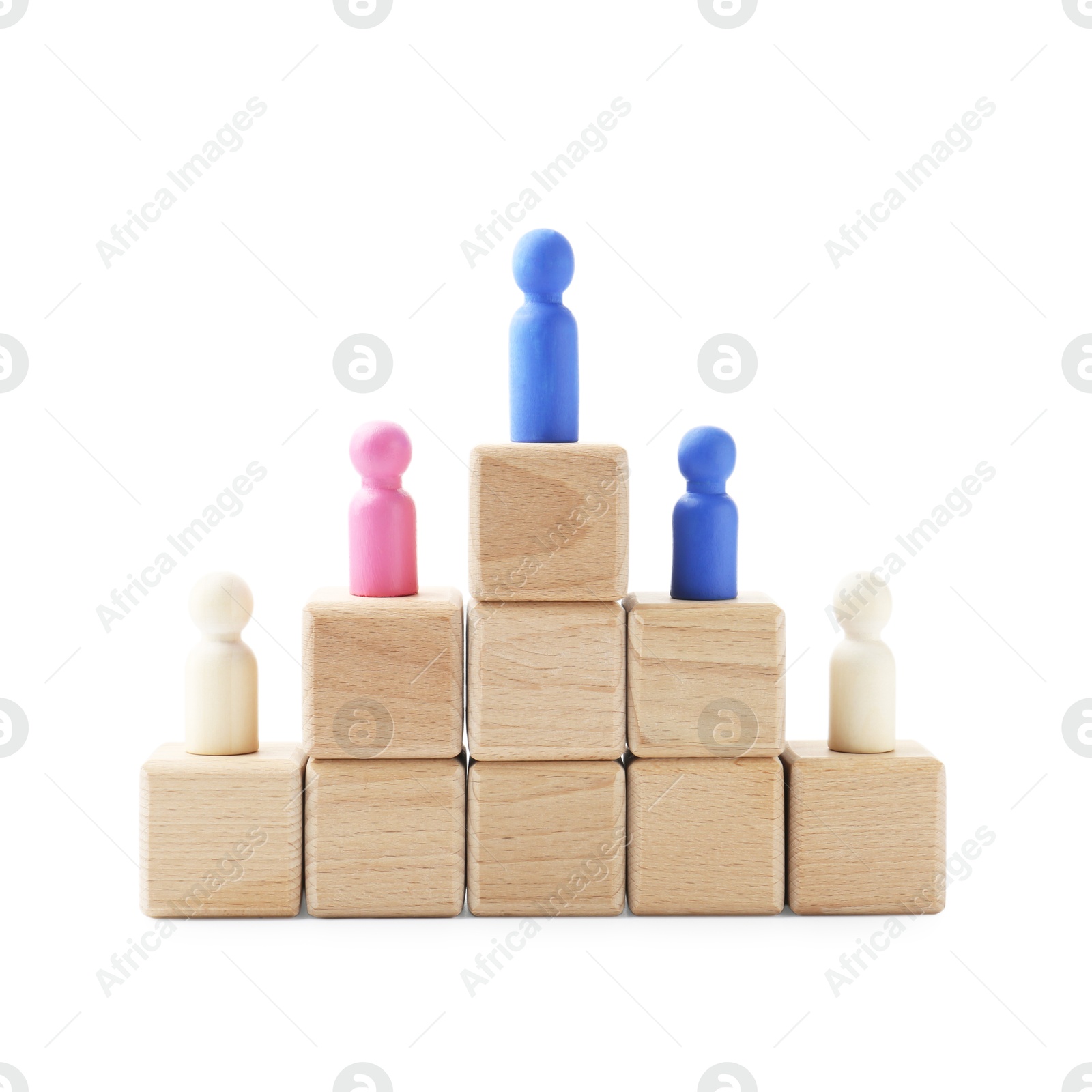 Photo of Human figures on wooden blocks, blue one on top against white background. Competition concept