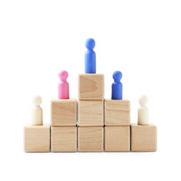 Photo of Human figures on wooden blocks, blue one on top against white background. Competition concept