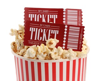 Photo of Tasty popcorn and movie tickets isolated on white