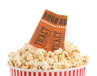 Photo of Tasty popcorn and movie tickets isolated on white