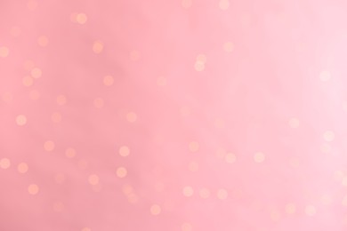 Photo of Pink background with blurred lights, bokeh effect