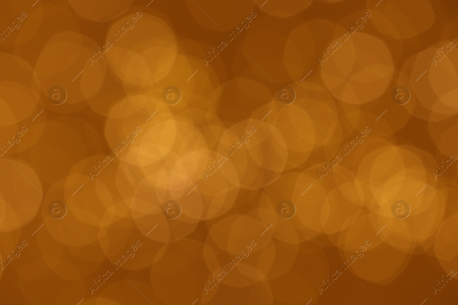 Photo of Golden background with blurred lights, bokeh effect