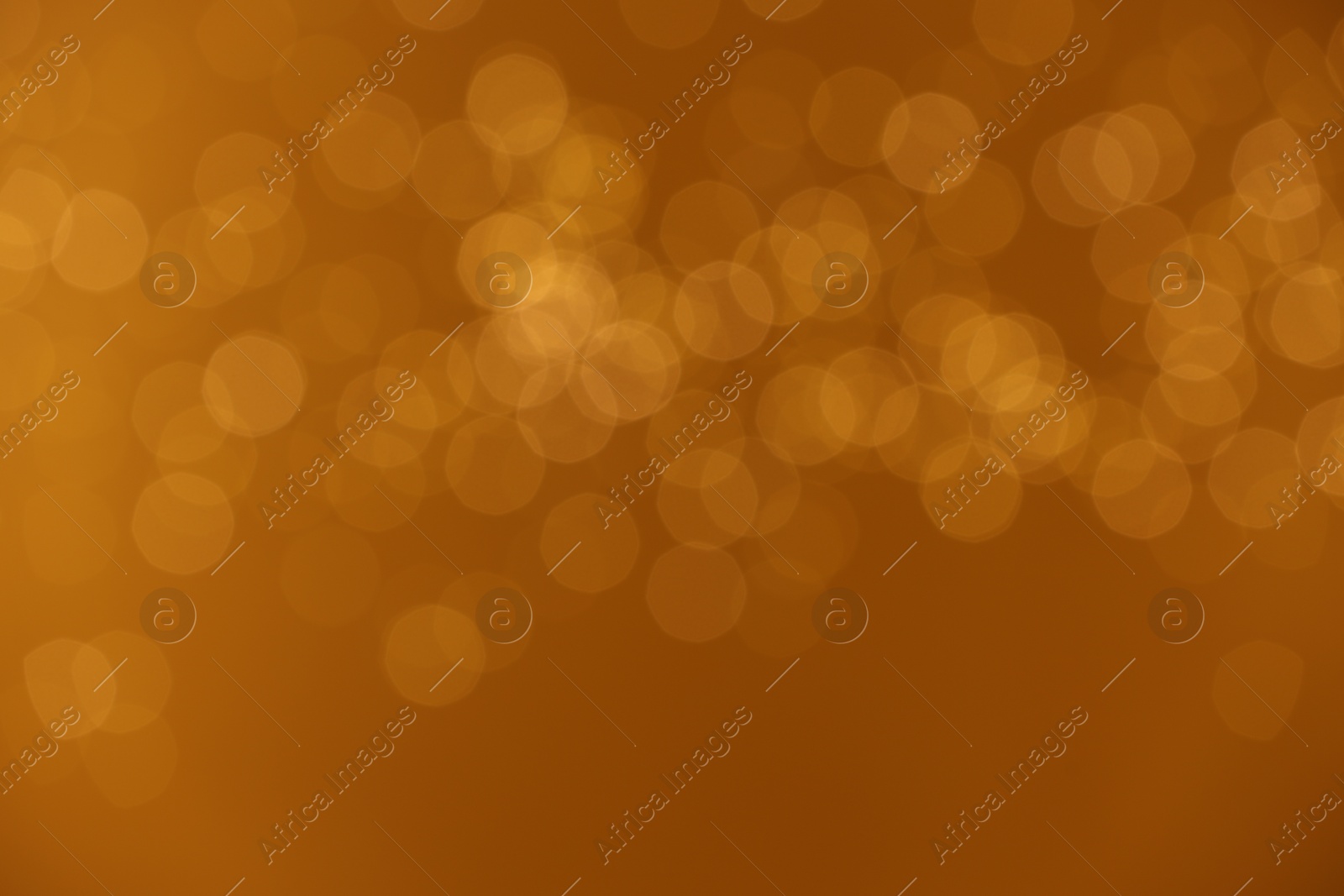 Photo of Golden background with blurred lights, bokeh effect