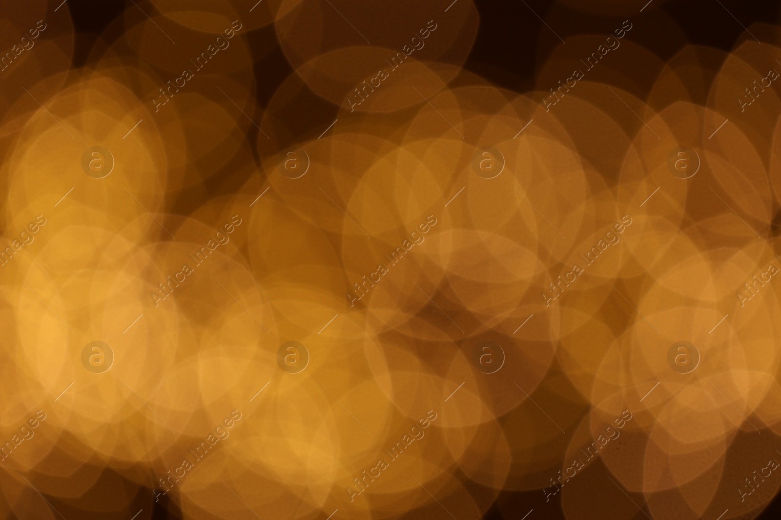 Photo of Blurred view of beautiful golden lights, bokeh effect