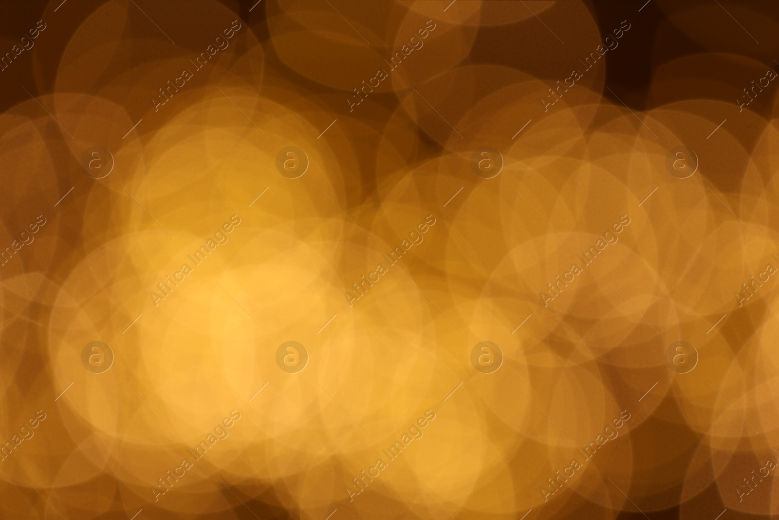 Photo of Blurred view of beautiful golden lights, bokeh effect