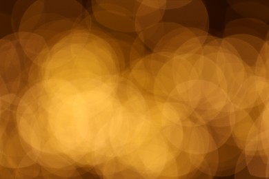 Photo of Blurred view of beautiful golden lights, bokeh effect