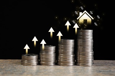 Real estate market. Stacked coins, arrows, illustration of house and percent signs on black background. Interest rate rise