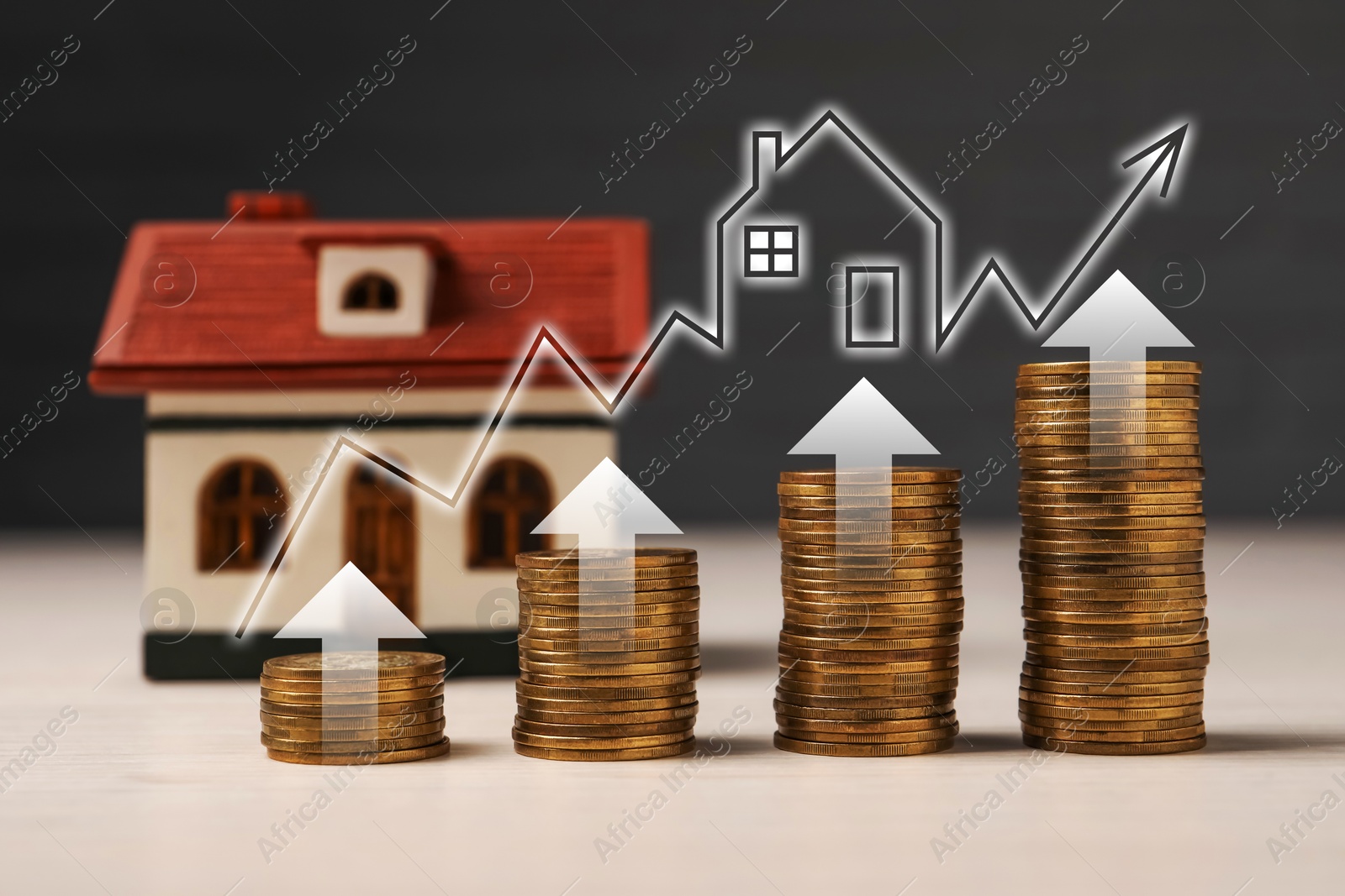 Image of Real estate market. Stacked coins and house model on table. Graphic and arrows visualizing interest rate rise