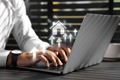 Image of Real estate market. Man using laptop, closeup. Arrows and illustration of house visualizing interest rate rise