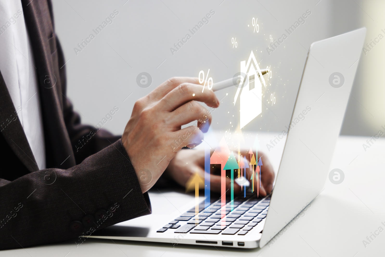 Image of Real estate market. Man using virtual screen over laptop, closeup. Arrows and illustration of house visualizing interest rate rise