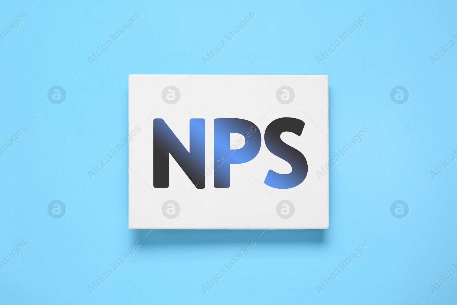 Image of Card with NPS (net promoter score) on light blue background, top view. Customer satisfaction assessment