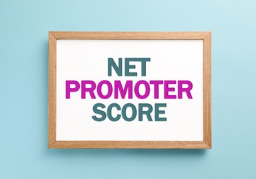 Image of Board with Net Promoter Score (NPS) on light blue background. Customer satisfaction assessment