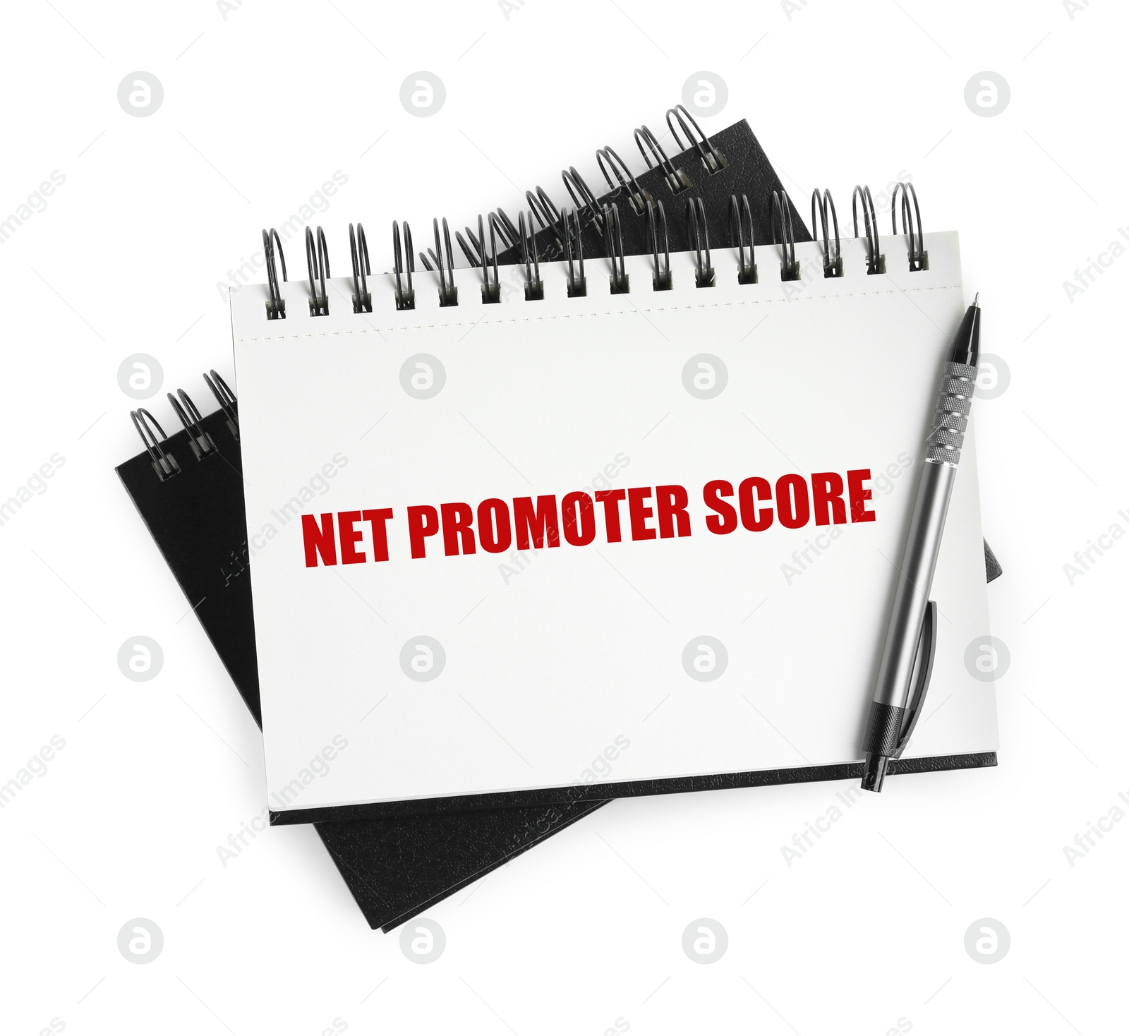 Image of NPS (net promoter score) in notebook and pen on white background, top view. Customer satisfaction assessment