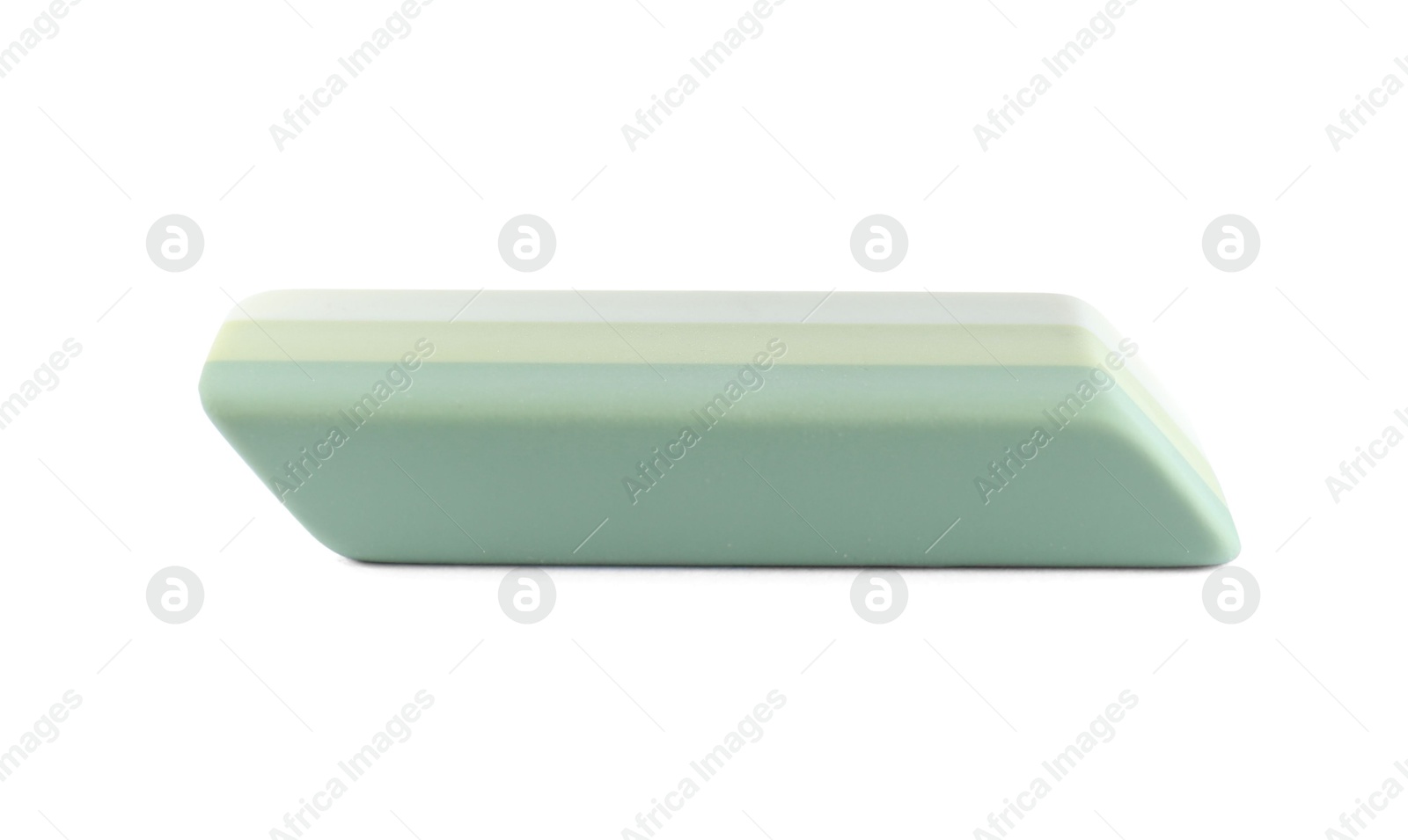 Photo of New bright eraser isolated on white. School stationery