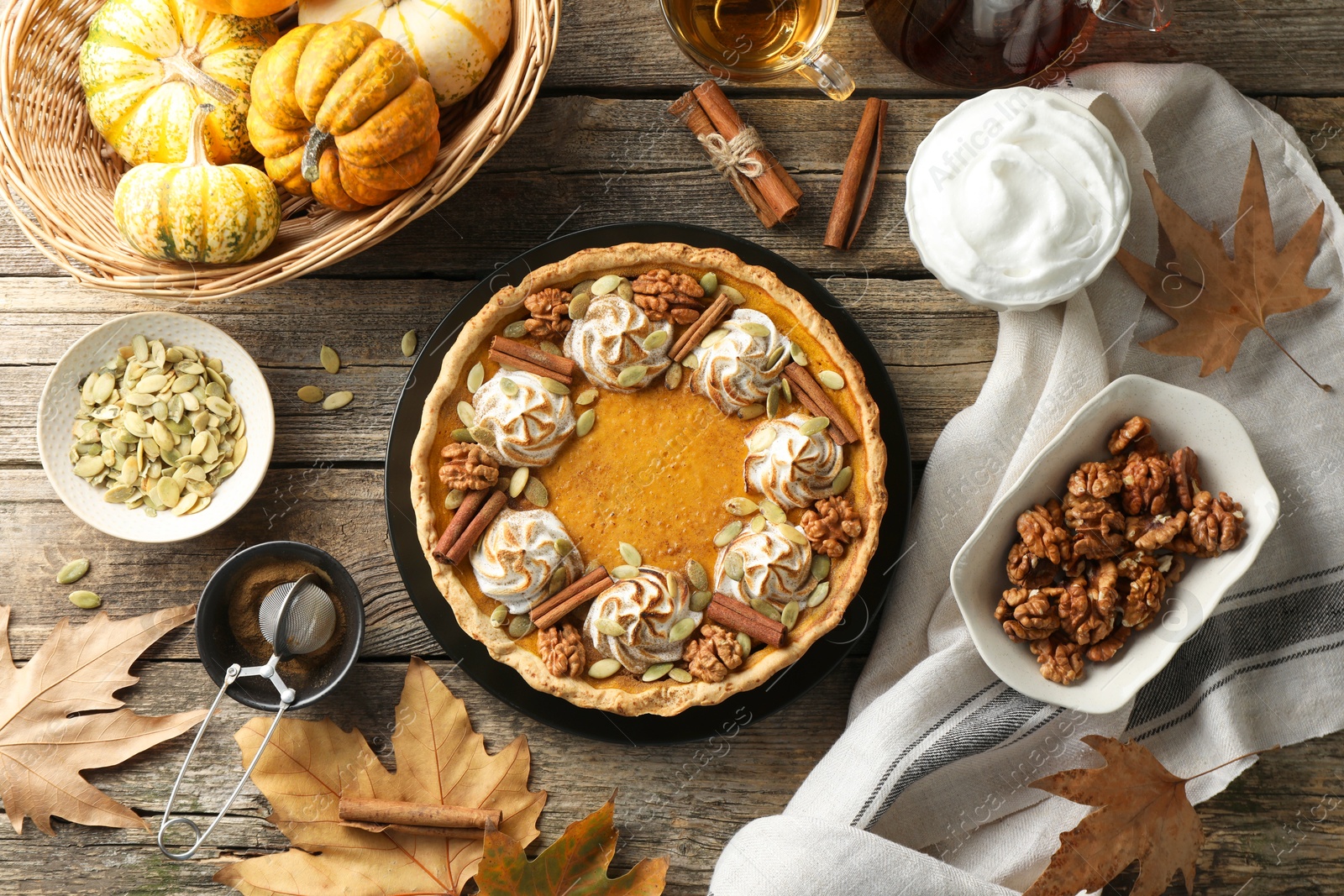 Photo of Flat lay composition with homemade pumpkin pie on wooden table