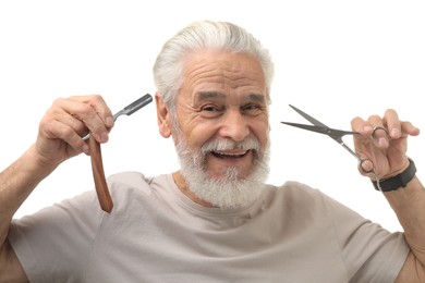 Photo of Bearded senior man holding blade and scissors on white background